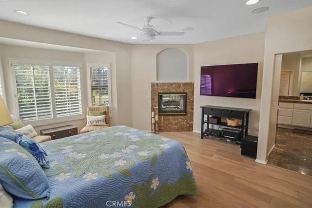 a bathroom with a toilet a sink and a large mirror