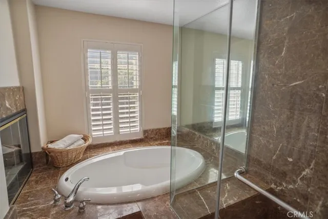 a very nice looking bedroom with wooden floor