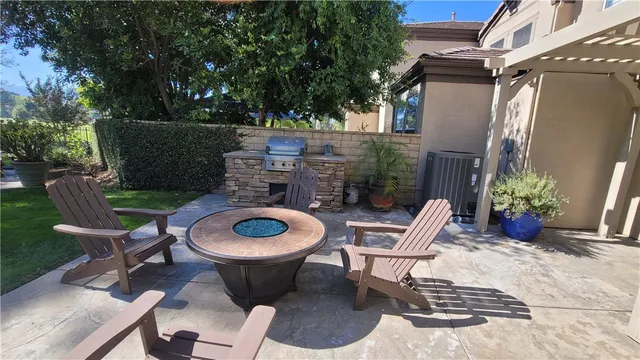 an outdoor space with patio the couches and a dining table with garden view