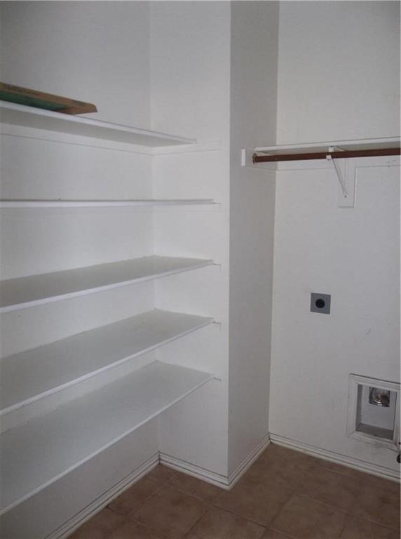 2820 Deer Ridge Drive Rockwall, TX 75032 - Photo 6 of 13 Built-in shelving, hanging rod, and utility connections