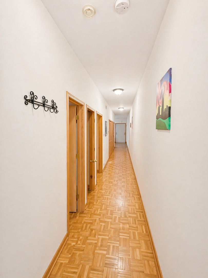 4237 North Kenmore Avenue, Unit GN Chicago, IL 60613 - Photo 7 of 12 a view of a hallway with stairs