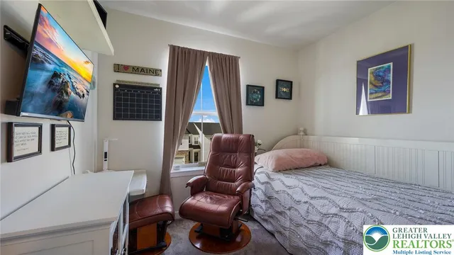 a bedroom with a bed and furniture