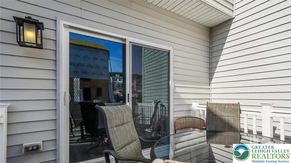 a view of a porch with seating space