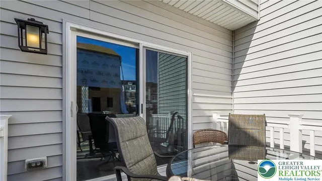 a view of a porch with seating space