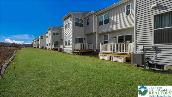 a view of a house with backyard