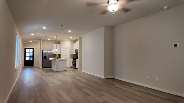 a view of a livingroom with a kitchen