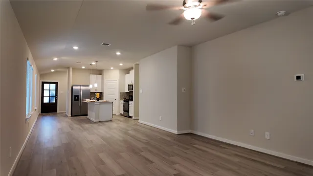 a view of a livingroom with a kitchen