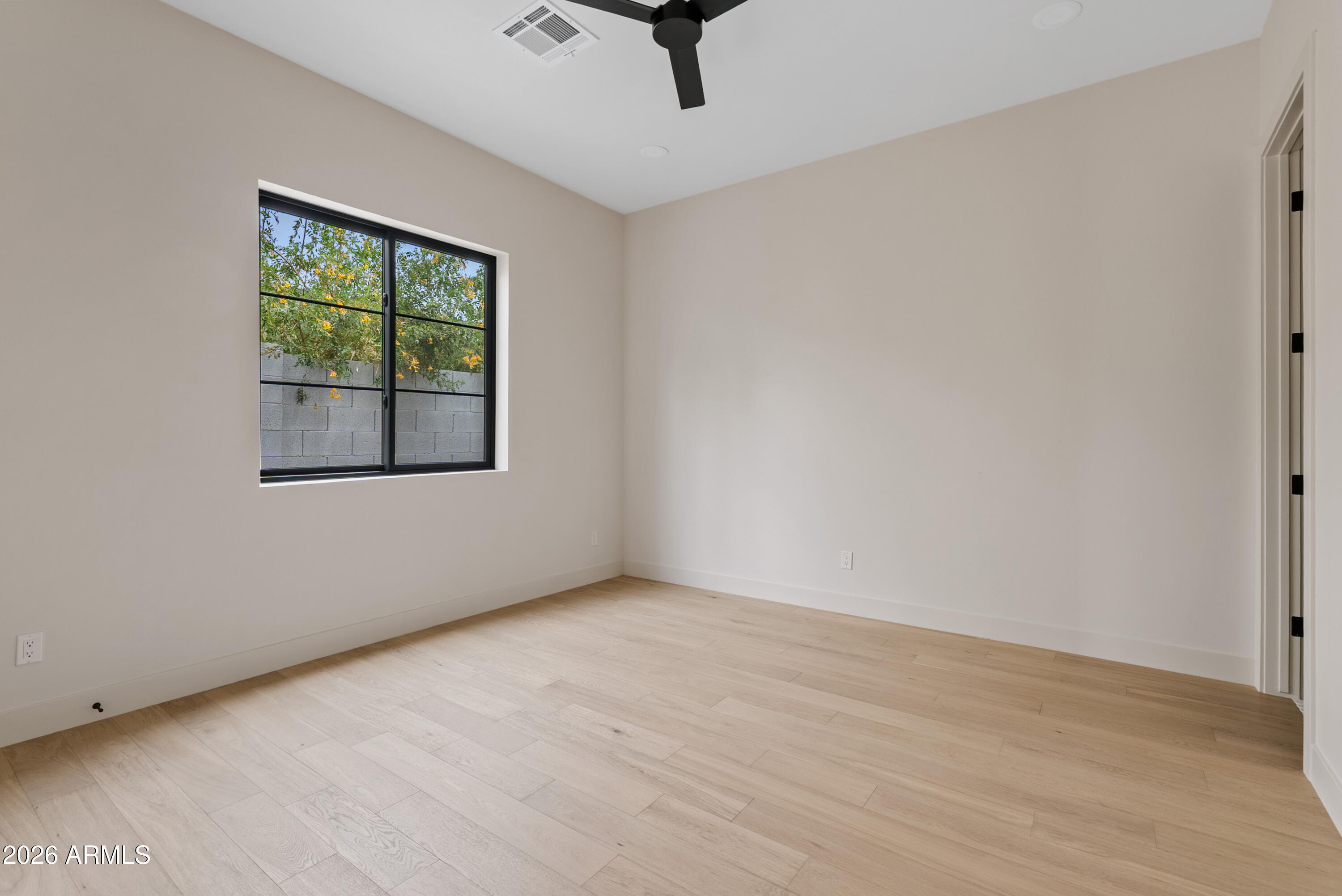 4035 East Osborn Road Phoenix, AZ 85018 - Photo 37 of 63 an empty room with a window