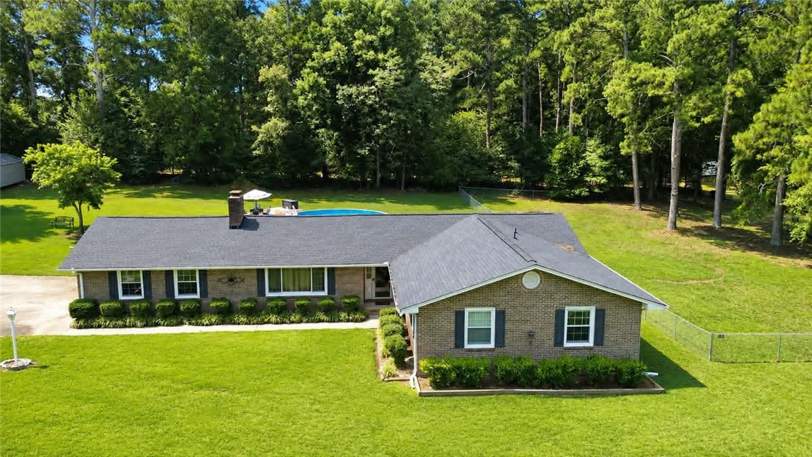 307 Mar-Mac Road Anderson, SC 29626 - Photo 2 of 19 A classic brick residence features a spacious backyard with a private pool, fenced-in dog run and mature trees.