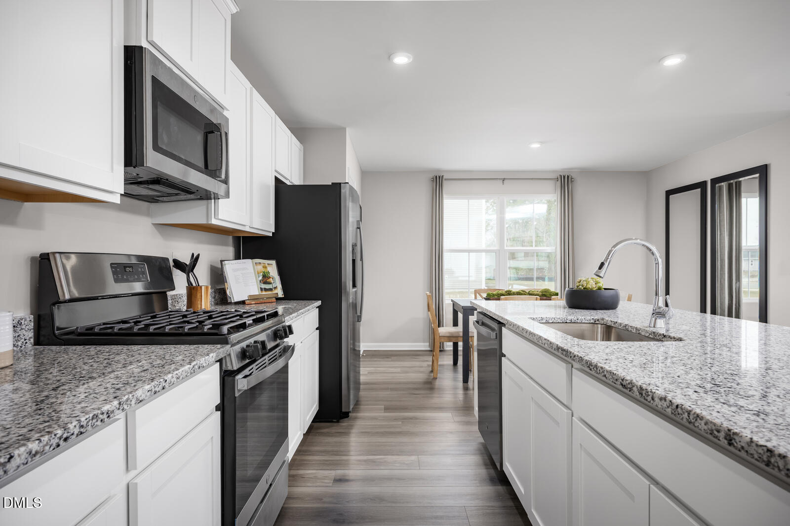 112 Cavalier Rider Run Wendell, NC 27591 - Photo 4 of 21 a kitchen with stainless steel appliances granite countertop a sink stove and refrigerator