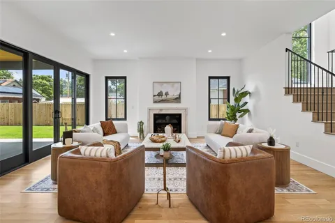 a living room with furniture couches and a fireplace
