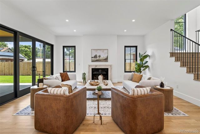 a living room with furniture couches and a fireplace