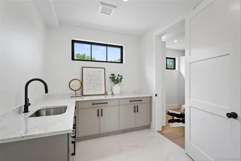 a view of a hallway with wooden floor and glass door