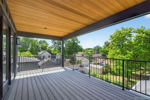 an empty room with a kitchen and a window