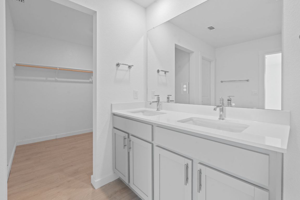 9704 Oxbow Strap Drive Austin, TX 78724 - Photo 15 of 22 a bathroom with a sink and a mirror