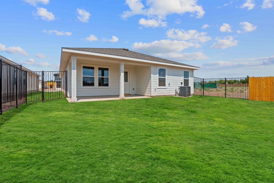 9704 Oxbow Strap Drive Austin, TX 78724 - Photo 21 of 22 a front view of house with yard and green space