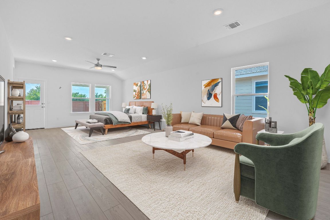 9704 Oxbow Strap Drive Austin, TX 78724 - Photo 3 of 22 a living room with furniture and a wooden floor