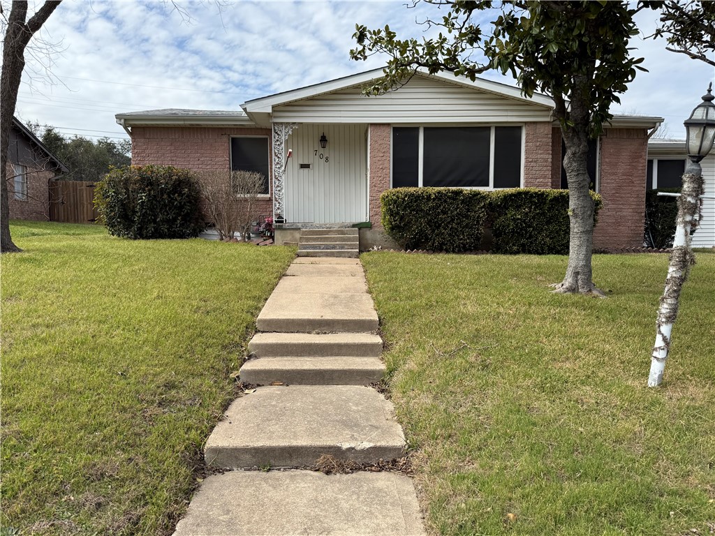 708 South 32nd Street Temple, TX 76501 - Photo 2 of 8 a front view of a house with a yard
