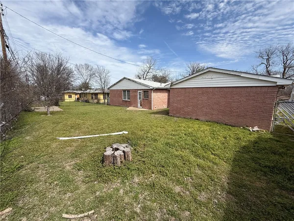 a view of a house with a yard and garage
