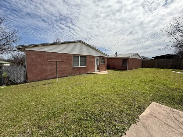 a view of a house with a yard and garage