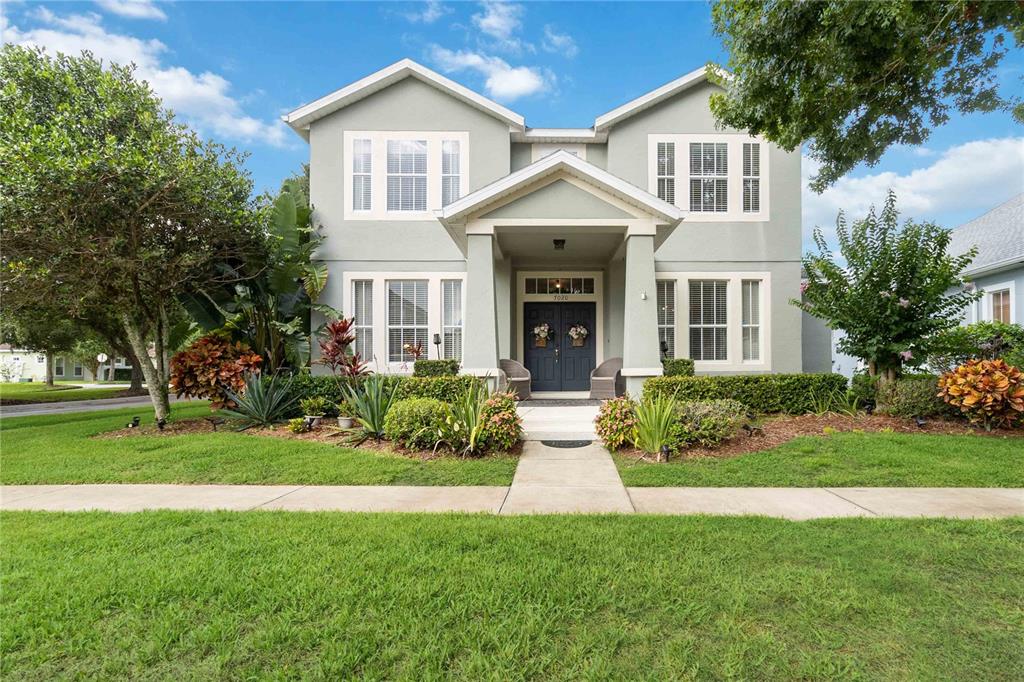 7020 Buttonbush Loop Harmony, FL 34773 - Photo 1 of 1 a front view of a house with a yard and trees