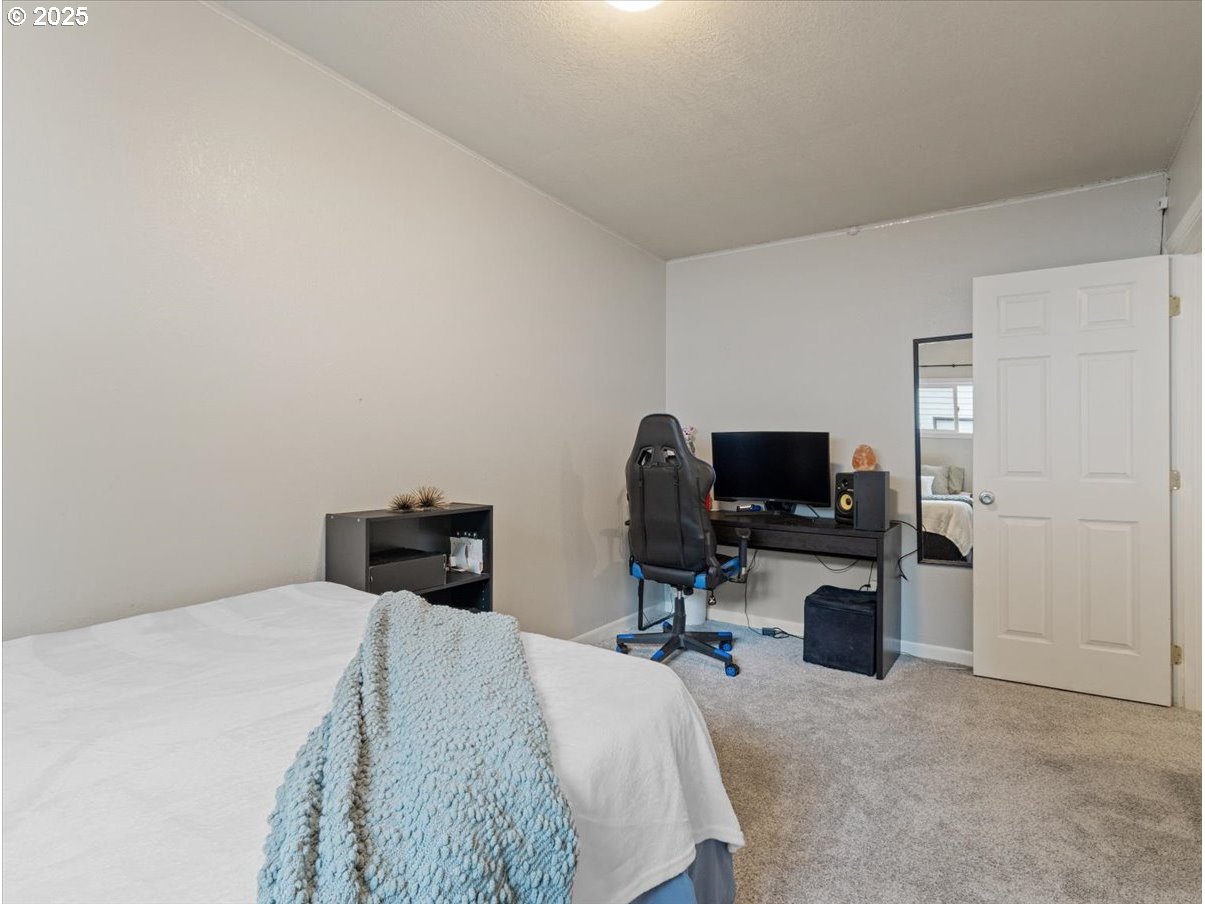 2102 Kelly Road, Unit 3 Vancouver, WA 98665 - Photo 13 of 20 a bedroom with a bed tv and chair