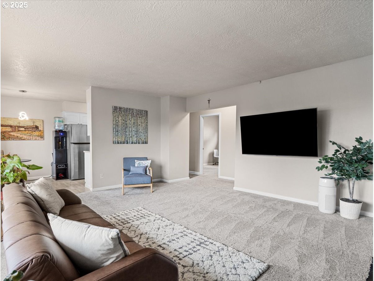 2102 Kelly Road, Unit 3 Vancouver, WA 98665 - Photo 7 of 20 a living room with furniture and a flat screen tv