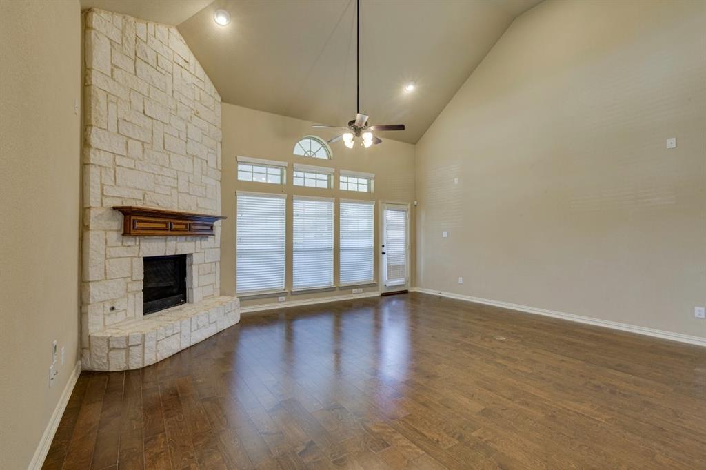 1522 Blue Jay Road Garland, TX 75043 - Photo 9 of 32 Spacious living area featuring a vaulted ceiling with recessed lighting and a ceiling fan
