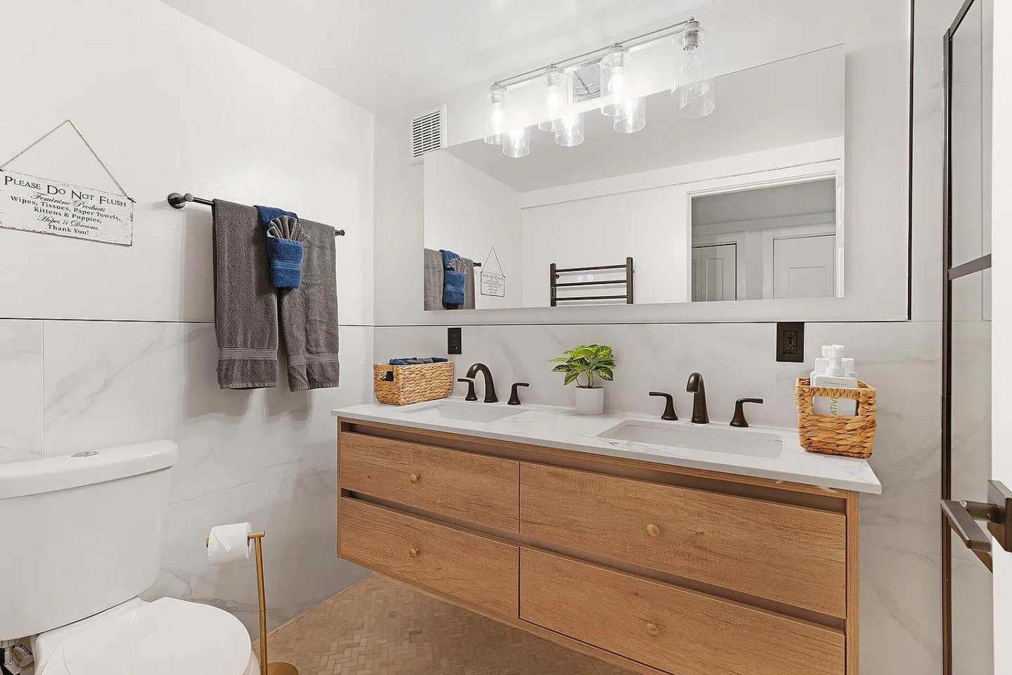 1003 Laurel Glen Road Soquel, CA 95073 - Photo 50 of 101 a bathroom with a sink a toilet and mirror
