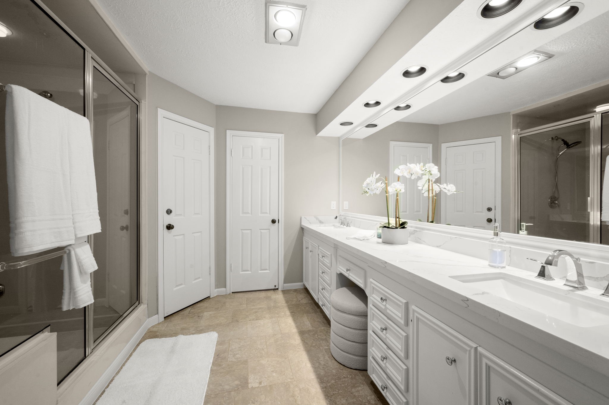 16111 Maplehurst Drive Spring, TX 77379 - Photo 15 of 30 a spacious bathroom with a double vanity sink a mirror and a shower