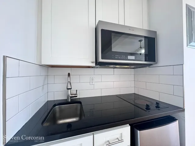 a living room with furniture and window