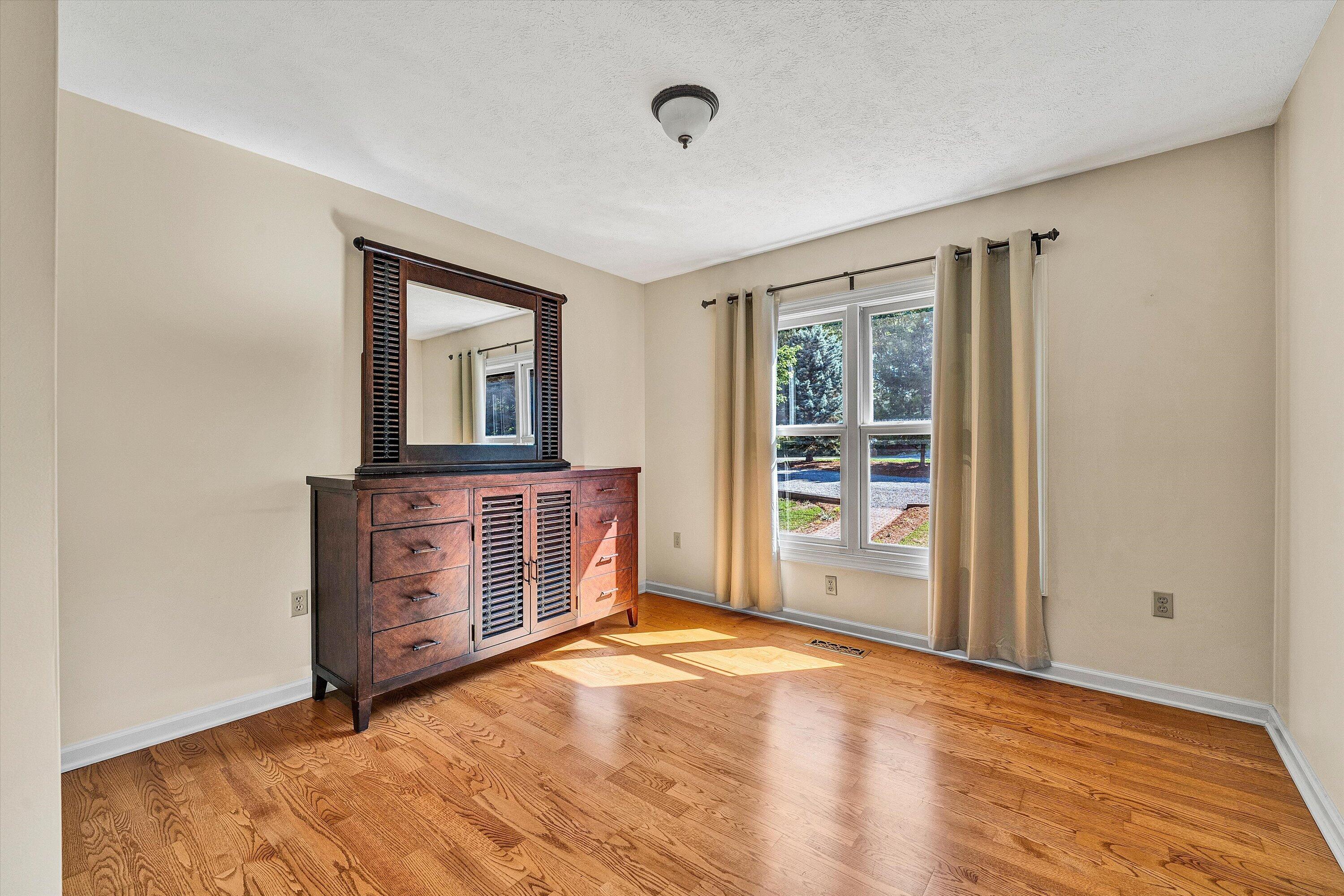 400 Harbor Moneta, VA 24121 - Photo 17 of 51 wooden floor in an empty room with a window