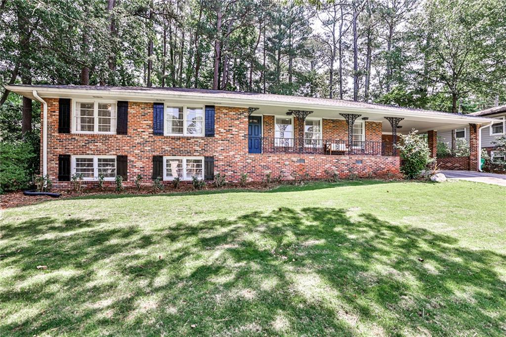 front view of a house with a yard