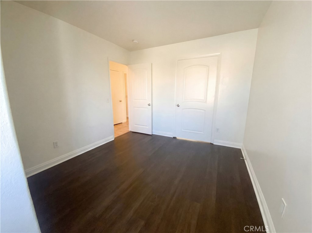 14433 Green River Road Victorville, CA 92394 - Photo 15 of 27 an empty room with wooden floor