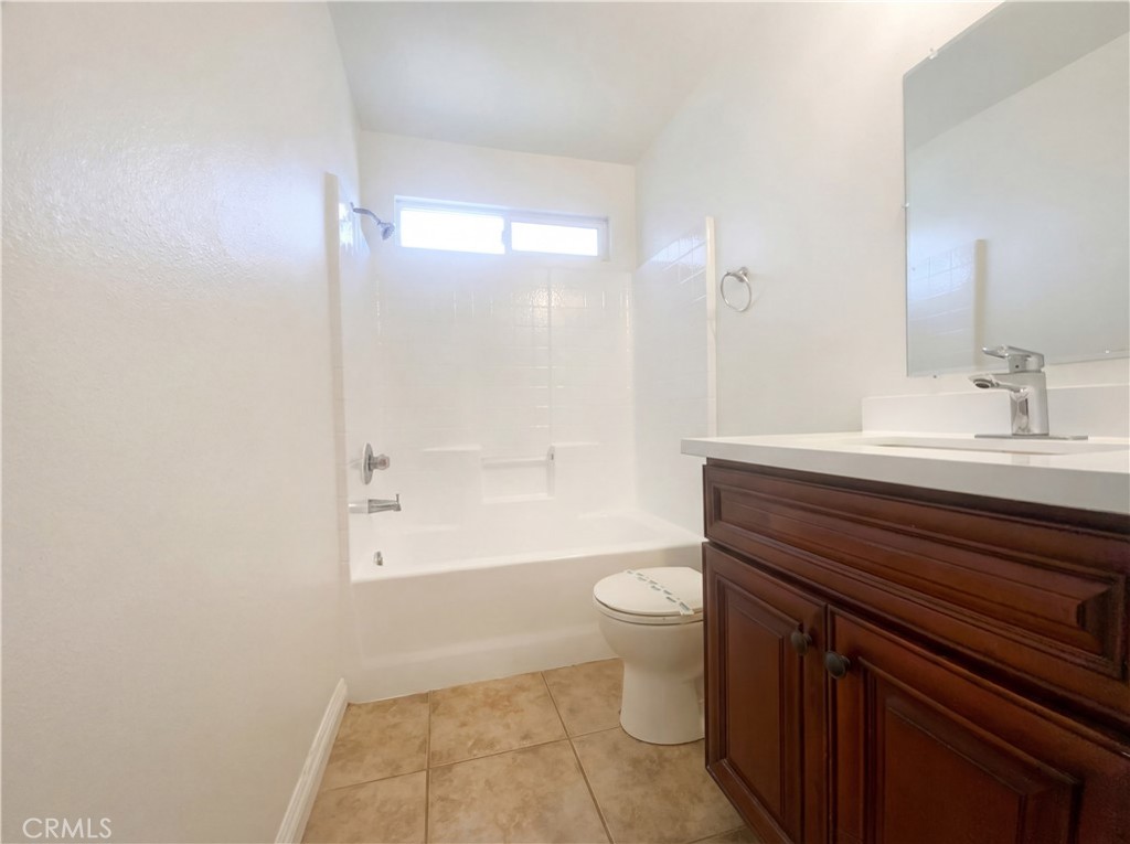 14433 Green River Road Victorville, CA 92394 - Photo 18 of 27 a bathroom with a sink a toilet and shower