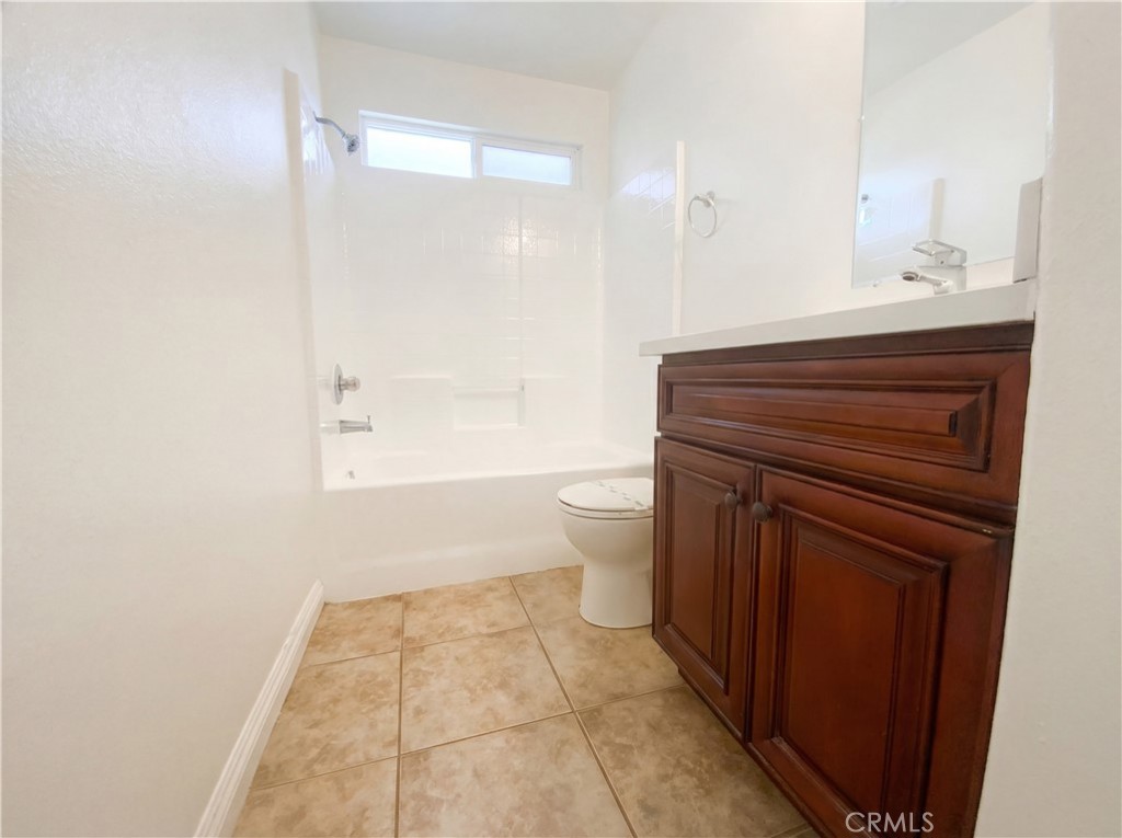 14433 Green River Road Victorville, CA 92394 - Photo 19 of 27 a bathroom with a sink a toilet and shower
