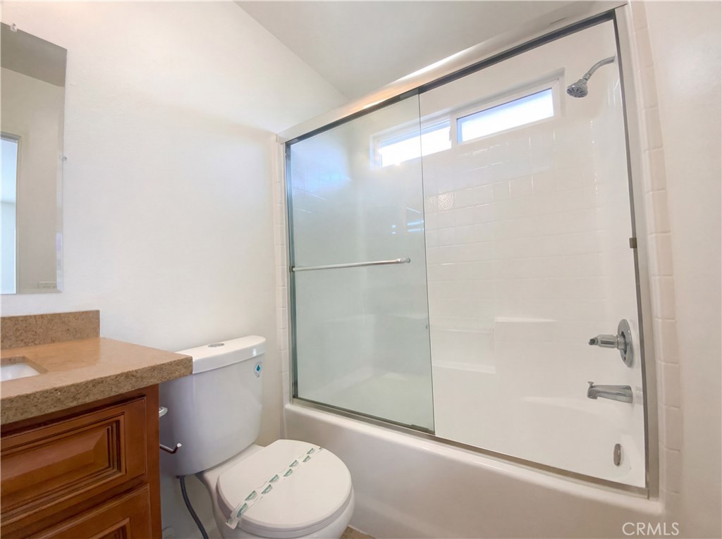 14433 Green River Road Victorville, CA 92394 - Photo 23 of 27 a white toilet sitting next to a bathroom sink