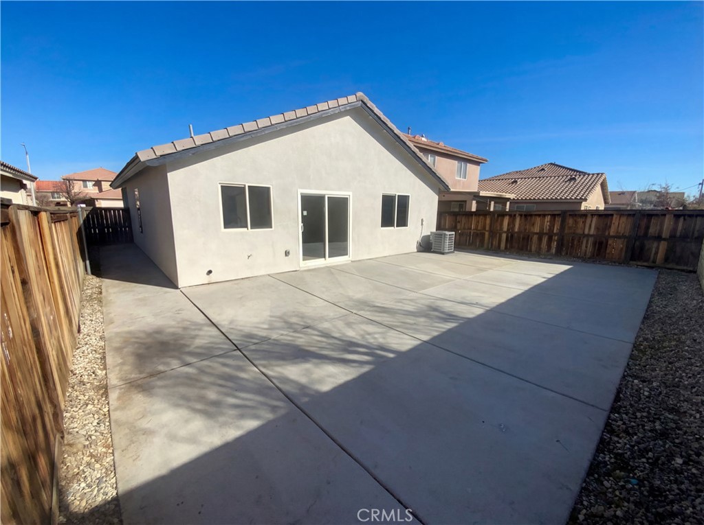 14433 Green River Road Victorville, CA 92394 - Photo 6 of 27 a view of a house with a backyard