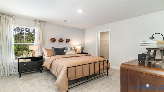 a bedroom with a bed and a table