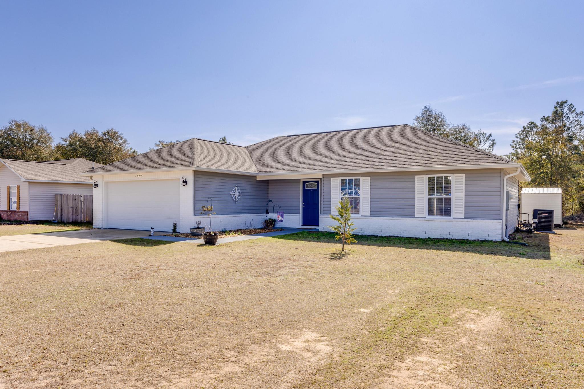 4694 Bobolink Way Crestview, FL 32539 - Photo 1 of 16 a view of a house with a yard and covered with snow