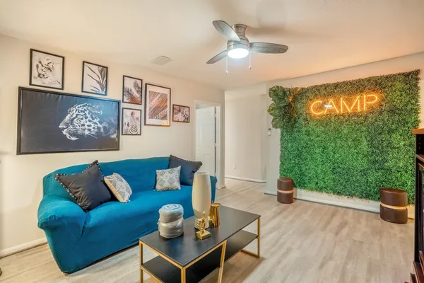 a living room with furniture and a fireplace