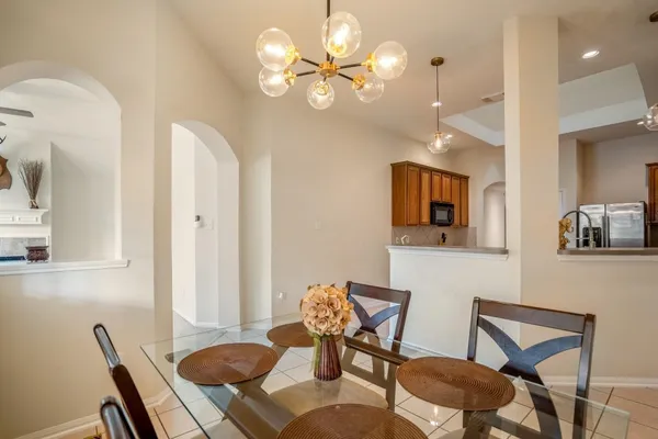 a living room with furniture a fireplace and a large window