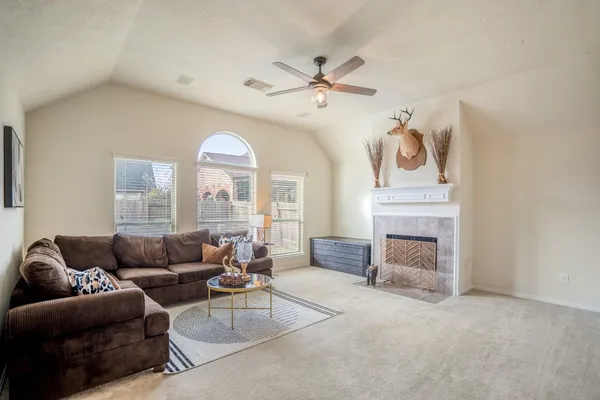 a living room with furniture and a large window