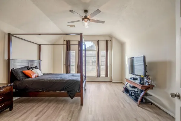 a spacious bathroom with a double vanity sink a mirror and a bathtub