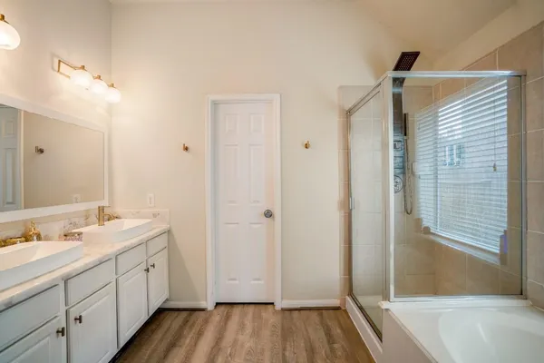 a bath tub sitting next to a window