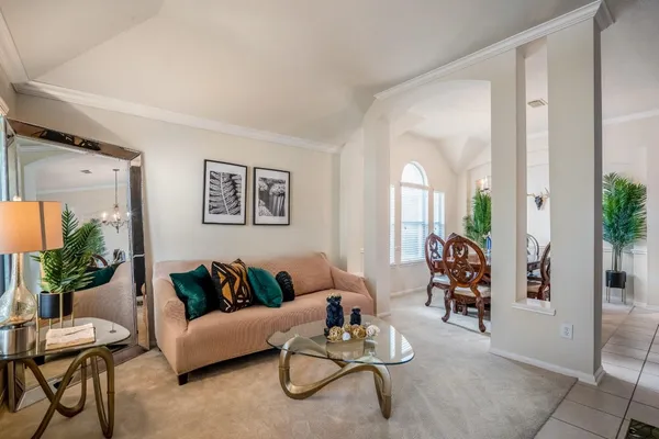 a living room with furniture and a window