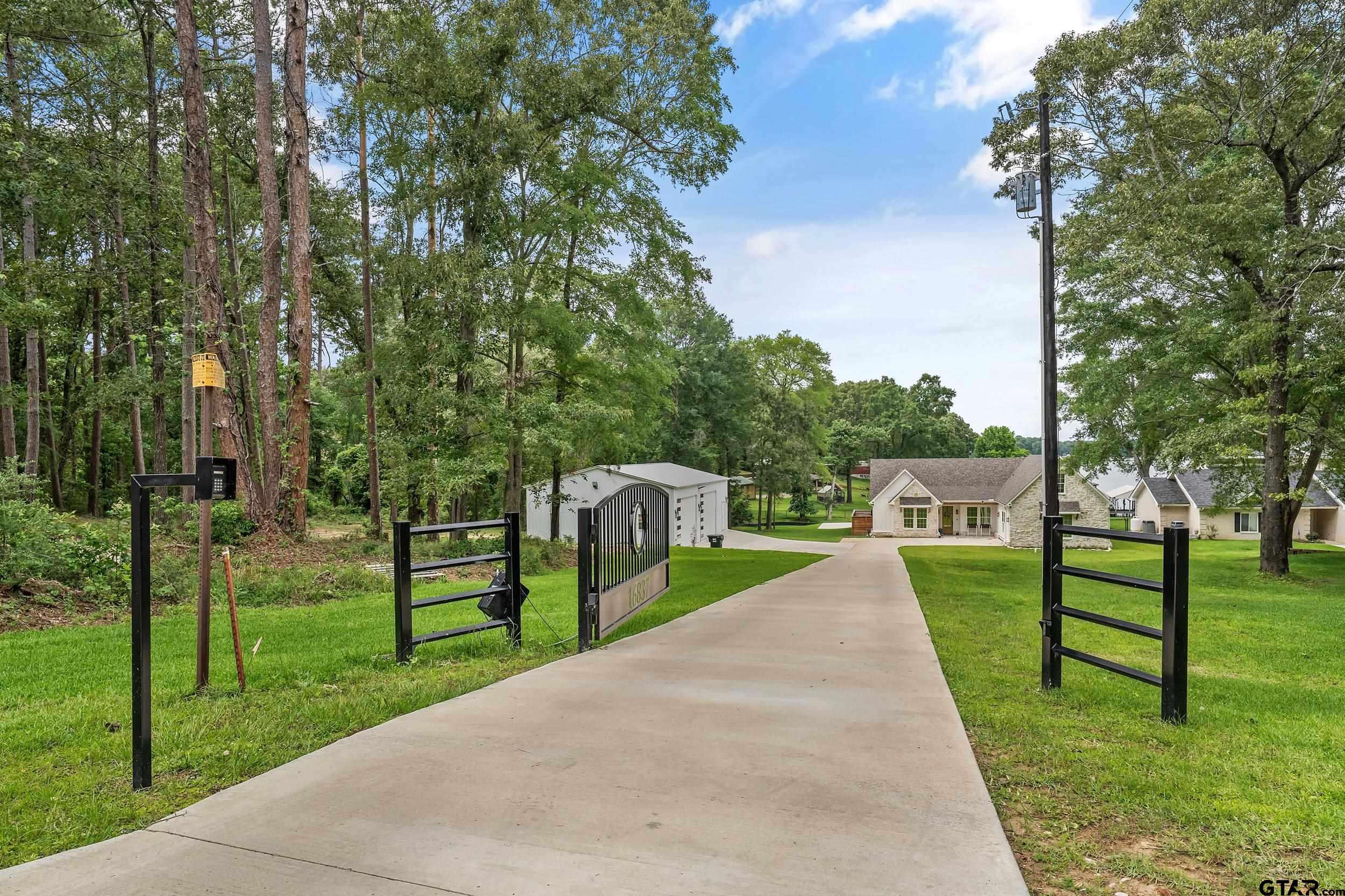 16837 Wilson Road Tyler, TX 75707 - Photo 3 of 44 a view of a park with large trees