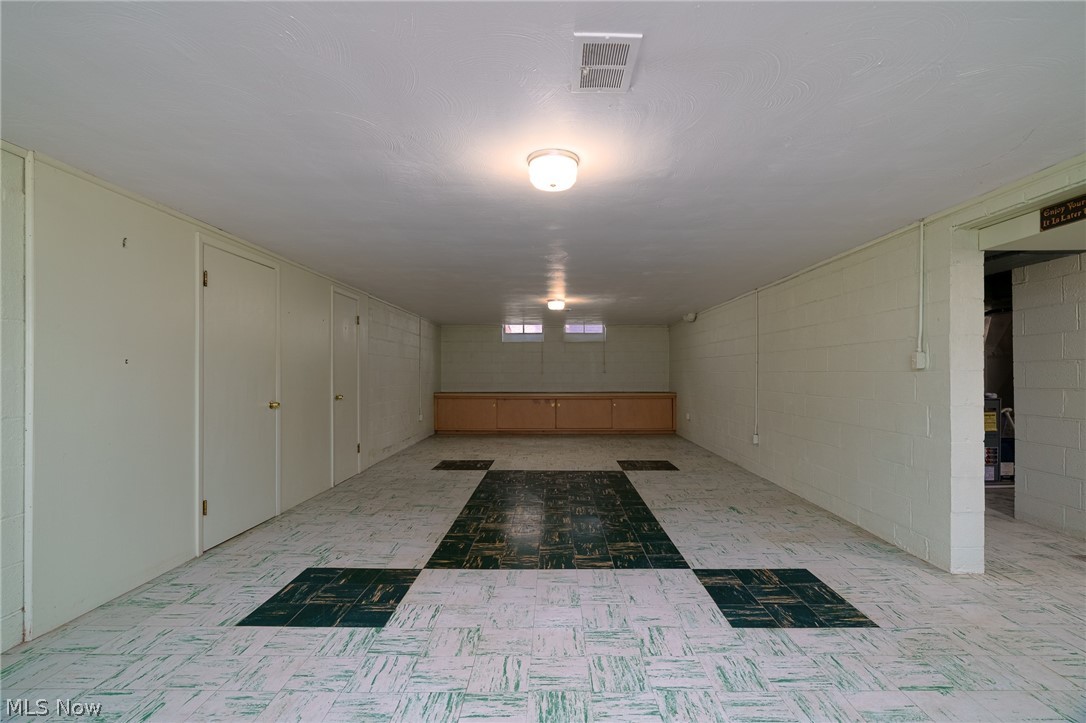 6572 South Canterbury Road Cleveland, OH 44129 - Photo 23 of 36 Lots of additional living space in this recreation room that has built-in cabinets and storage closets