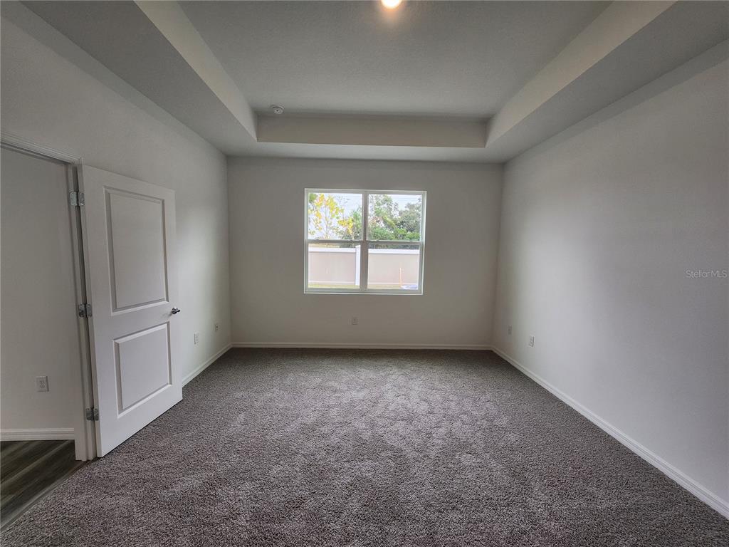 32760 Rustic Rise Road San Antonio, FL 33576 - Photo 11 of 27 an empty room with windows