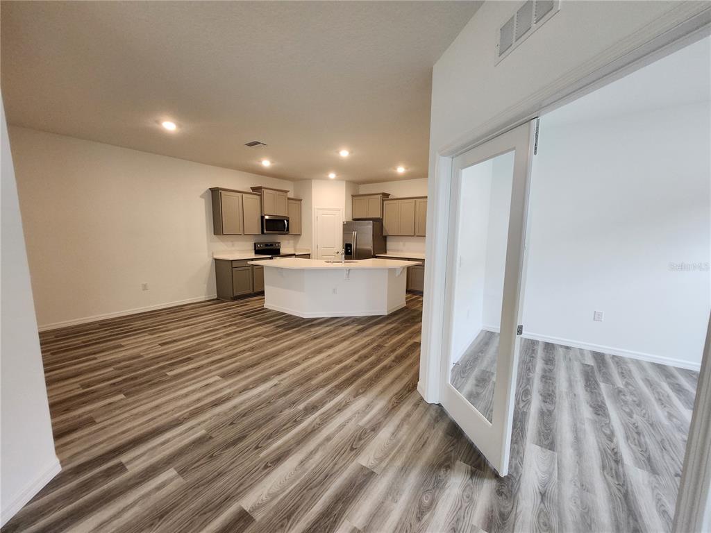32760 Rustic Rise Road San Antonio, FL 33576 - Photo 16 of 27 a view of kitchen and wooden floor